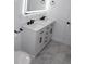 Bathroom features a double sink vanity, elegant fixtures, and modern lighting at 8524 Fish Lake Rd, Tampa, FL 33619