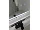 Close-up of bathroom mirror with integrated touch screen and elegant faucet at 8524 Fish Lake Rd, Tampa, FL 33619
