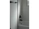 Modern bathroom features a white tub with black fixtures at 8524 Fish Lake Rd, Tampa, FL 33619