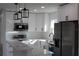 Bright kitchen showcasing stainless appliances and pendant lighting at 8524 Fish Lake Rd, Tampa, FL 33619
