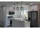 White cabinets, stainless appliances and island in this kitchen at 8524 Fish Lake Rd, Tampa, FL 33619