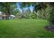 Expansive backyard with mature trees offering privacy and plenty of room at 8610 Fish Lake Rd, Tampa, FL 33619