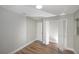 A clean bedroom with neutral walls and flooring including a closet at 8610 Fish Lake Rd, Tampa, FL 33619