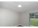 Bright bedroom with a window and a skylight at 8610 Fish Lake Rd, Tampa, FL 33619