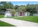 Inviting single-Gathering home with a well-manicured lawn and beautiful front entrance at 8610 Fish Lake Rd, Tampa, FL 33619