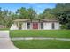 Inviting single-Gathering home with a well-manicured lawn and beautiful front entrance at 8610 Fish Lake Rd, Tampa, FL 33619