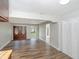 Light-filled living room features wood floors, updated trim, and an open view to the front entrance at 8610 Fish Lake Rd, Tampa, FL 33619