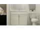 Neutral toned bathroom featuring a single sink vanity with gray countertop and neutral paint at 9360 Gladsome Dr, Land O Lakes, FL 34637