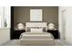 Relaxing bedroom featuring a comfortable bed with stylish neutral-toned bedding and dark wood nightstands at 9360 Gladsome Dr, Land O Lakes, FL 34637