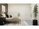 Bedroom features a platform bed, bedside tables, and a decorative tree at 9360 Gladsome Dr, Land O Lakes, FL 34637