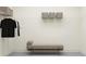 Spacious closet with wire shelving, clothing, storage baskets, and a comfortable bench at 9360 Gladsome Dr, Land O Lakes, FL 34637