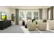 Comfortable living room featuring a sectional sofa, side table, and plentiful natural light from three windows at 9360 Gladsome Dr, Land O Lakes, FL 34637