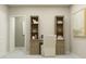 Bright and stylish study featuring a built-in desk, shelves for books, and adjacent entryway at 9417 Cannon Beach Dr, Parrish, FL 34219
