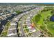 Birds eye view of a suburban community with waterfront property, a golf course, and nearby ocean at 955 Signet Dr, Apollo Beach, FL 33572