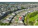 Scenic aerial view of a community with water access, lush landscaping, and residential homes at 955 Signet Dr, Apollo Beach, FL 33572