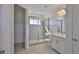 Bright bathroom featuring tiled shower and white vanity at 955 Signet Dr, Apollo Beach, FL 33572