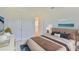 Comfortable bedroom featuring neutral decor and cozy bedding at 955 Signet Dr, Apollo Beach, FL 33572