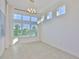 Bright dining room with a chandelier and big windows at 955 Signet Dr, Apollo Beach, FL 33572