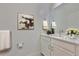 Stylish powder room with white vanity, marble countertop, and modern accents at 955 Signet Dr, Apollo Beach, FL 33572