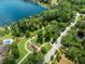 Aerial view of park and lake, featuring a scenic walking path and gazebo at 1014 Stella Vara Dr, Lutz, FL 33548