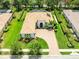 Stunning aerial view of the home highlighting its pristine landscaping, paver driveway, and elegant architecture at 1014 Stella Vara Dr, Lutz, FL 33548