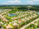 Beautiful community with lake, lush trees and the featured property identified by a location pin at 1014 Stella Vara Dr, Lutz, FL 33548