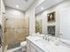 Modern bathroom featuring glass shower doors, a marble countertop, and elegant fixtures at 1014 Stella Vara Dr, Lutz, FL 33548