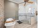 Open bathroom area with soaker tub and shower behind glass partition provides seamless transition at 1014 Stella Vara Dr, Lutz, FL 33548