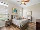 Bedroom with natural light, comfortable bed, and stylish decor at 1014 Stella Vara Dr, Lutz, FL 33548