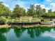 Beautiful community entrance with a water feature, lush landscaping, and stone accents at 1014 Stella Vara Dr, Lutz, FL 33548
