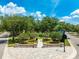 Street view of a lovely park with a walking path, landscaping and shade trees at 1014 Stella Vara Dr, Lutz, FL 33548