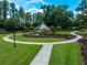 Lush community park with walking path and gazebo, great for relaxation and recreation at 1014 Stella Vara Dr, Lutz, FL 33548