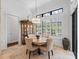 Bright dining area with natural light, stylish furniture, and a decorative hutch at 1014 Stella Vara Dr, Lutz, FL 33548