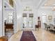 Bright foyer features travertine floors, white trim, art niches, and direct views to the entry at 1014 Stella Vara Dr, Lutz, FL 33548