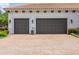 Attached two-car garage with paved driveway, perfect for secure parking at 1014 Stella Vara Dr, Lutz, FL 33548