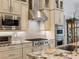 Modern kitchen with stainless steel appliances, granite countertops, and custom cabinets at 1014 Stella Vara Dr, Lutz, FL 33548