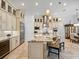 Open concept kitchen featuring a large island, custom cabinets, and modern stainless steel appliances at 1014 Stella Vara Dr, Lutz, FL 33548
