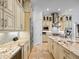 Gourmet kitchen with stainless steel appliances, custom cabinets and a large center island at 1014 Stella Vara Dr, Lutz, FL 33548