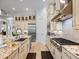A gourmet kitchen featuring granite counters, stainless steel appliances, and custom cabinetry at 1014 Stella Vara Dr, Lutz, FL 33548