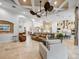 Spacious living room featuring open-concept design with views into the kitchen and dining areas at 1014 Stella Vara Dr, Lutz, FL 33548
