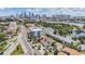 Scenic aerial showcases the skyline, waterfront, and a neighborhood with lush trees at 103 E Davis Blvd # B, Tampa, FL 33606