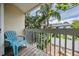 Private balcony with a chair and a view of the yard filled with lush tropical greenery at 103 E Davis Blvd # B, Tampa, FL 33606