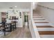 Bright dining room featuring a staircase and view to kitchen at 103 E Davis Blvd # B, Tampa, FL 33606