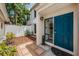 Inviting front entrance with a stylish blue door and charming garden area at 103 E Davis Blvd # B, Tampa, FL 33606