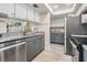 A cozy kitchen featuring granite counter tops and stainless steel appliances at 103 E Davis Blvd # B, Tampa, FL 33606