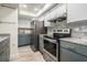 Bright kitchen with stainless steel appliances, granite countertops, and sleek cabinetry at 103 E Davis Blvd # B, Tampa, FL 33606