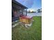 Backyard features a relaxing hot tub area surrounded by green lawn at 10539 Egret Haven Ln, Riverview, FL 33578