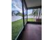 View of the screened patio and fenced backyard offers a private outdoor living experience at 10539 Egret Haven Ln, Riverview, FL 33578