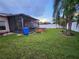 Well-maintained backyard features a hot tub, screened patio, and plenty of green space at 10539 Egret Haven Ln, Riverview, FL 33578