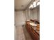Bathroom featuring granite countertops and shower over tub at 10539 Egret Haven Ln, Riverview, FL 33578